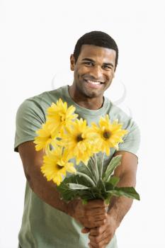 Royalty Free Photo of a Man Holding Out a Bouquet