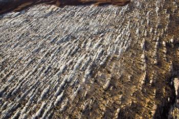 Aerial view of a rocky landscape with snow on the ground. Horizontal shot.