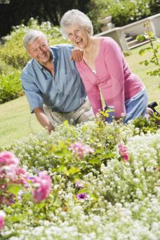 Royalty Free Photo of a Retired Couple in a Garden