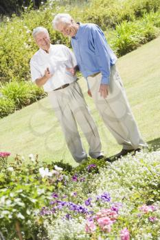 Royalty Free Photo of Two Senior Men in a Flower Garden