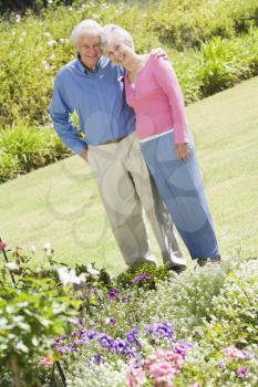 Royalty Free Photo of a Senior Couple in a Flower Garden