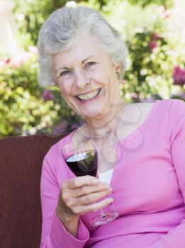 Royalty Free Photo of a Senior Woman With a Glass of Wine