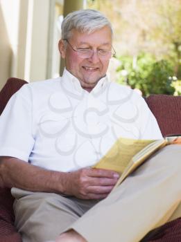 Royalty Free Photo of a Man Outside Reading