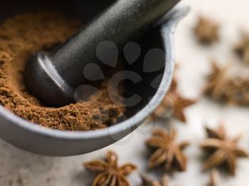 Royalty Free Photo of Ground Star Anise in a Pestle and Mortar