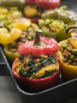 Royalty Free Photo of Bell Peppers Stuffed with Keema Sag Aloo and Vegetable Pilau