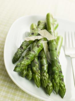 Royalty Free Photo of Chargrilled Asparagus Spears with Parmesan Cheese Shaves
