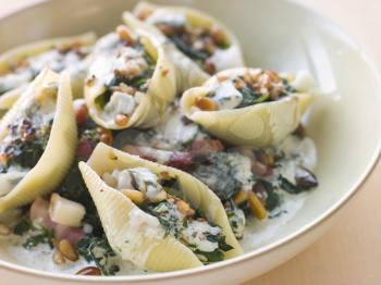 Royalty Free Photo of a Pasta Shells Stuffed With Vegetables and Cheese
