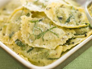 Royalty Free Photo of a Dish of Spinach and Ricotta Ravioli and Sage Butter