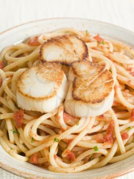 Royalty Free Photo of Seared Scallops With Chili and Tomato Spaghetti