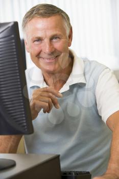 Royalty Free Photo of a Guy Sitting at a Computer
