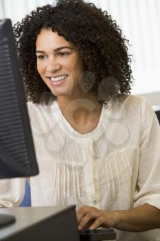 Royalty Free Photo of a Young Woman at a Computer