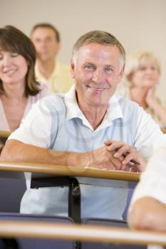 Royalty Free Photo of a Smiling Man in a Class