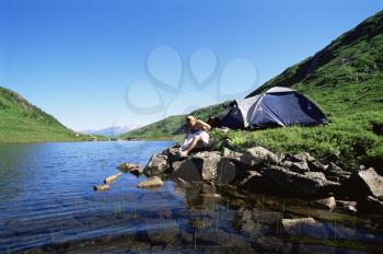 Royalty Free Photo of a Female Camper By a Rivert