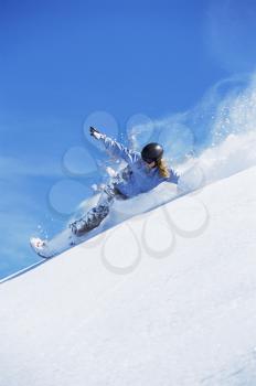 Royalty Free Photo of a Snowboarder Coming Downhill