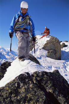 Royalty Free Photo of Mountain Climbers Walking on Rocks