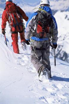 Royalty Free Photo of Two People in Mountaineering Gear Walking