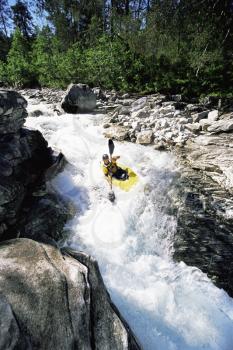 Royalty Free Photo of a Kayaker Going Over Waterfalls