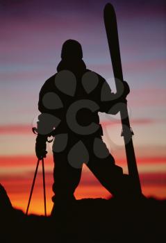 Royalty Free Photo of a Silhouetted Skier at Dusk