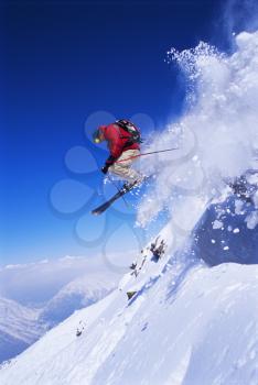 Royalty Free Photo of a Skier on a Snowy Hill