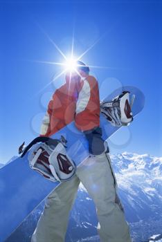 Royalty Free Photo of a Snowboarder Walking