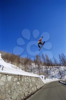 Royalty Free Photo of a Snowboarder Up in the Air