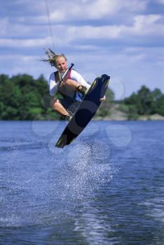Royalty Free Photo of a Woman on a Water Board
