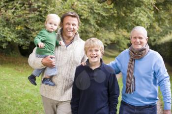 Royalty Free Photo of Three Generations of Men on a Country Trail