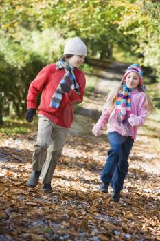 Royalty Free Photo of Two Children Running on a Path