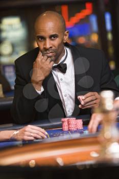 Royalty Free Photo of a Man at a Roulette Table