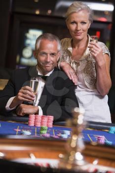 Royalty Free Photo of a Couple at a Roulette Table