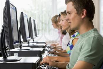 Royalty Free Photo of Students Sitting at a Computer