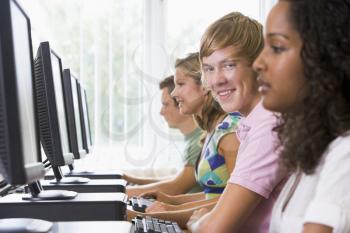 Royalty Free Photo of People Sitting at Computer Terminals