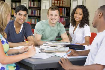 Royalty Free Photo of Students Around a Table