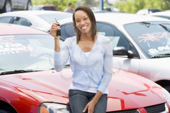 Royalty Free Photo of a Woman Holding Keys for a New Car