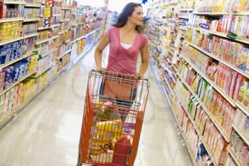 Royalty Free Photo of a Woman Shopping for Groceries