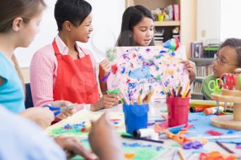 Royalty Free Photo of a Teacher and Students in Art Class