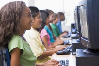 Royalty Free Photo of Six Children at Computer Terminals