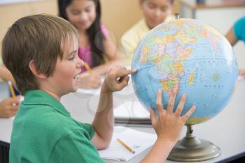 Royalty Free Photo of a Student With a Globe