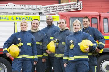 Royalty Free Photo of Firefighters in Front of the Rescue Vehicle
