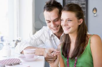 Royalty Free Photo of a Young Couple Having Tea
