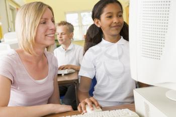 Royalty Free Photo of a Student and Teacher at a Computer