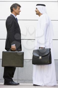 Royalty Free Photo of Two Men of Different Cultures With Briefcases