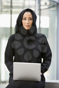 Royalty Free Photo of an Eastern Woman With a Laptop
