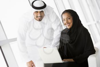 Royalty Free Photo of Two People Indoors With a Laptop