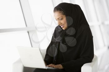 Royalty Free Photo of an Eastern Woman With a Laptop