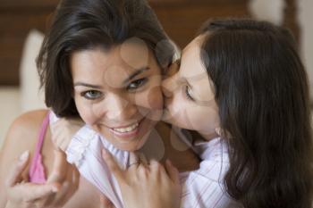 Royalty Free Photo of a Little Girl Kissing Her Mother