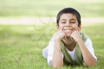 Royalty Free Photo of a Boy Lying in the Grass