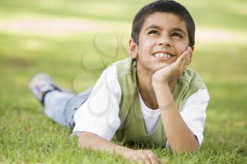 Royalty Free Photo of a Boy on the Lawn