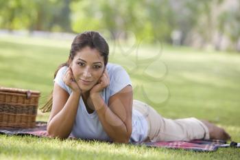 Royalty Free Photo of a Woman Outside With a Picnic Basket