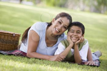 Royalty Free Photo of a Mother and Son Lying on the Grass